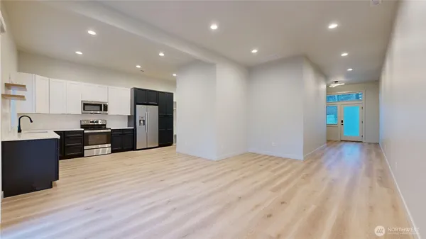 a kitchen with granite countertop cabinets and stainless steel appliances