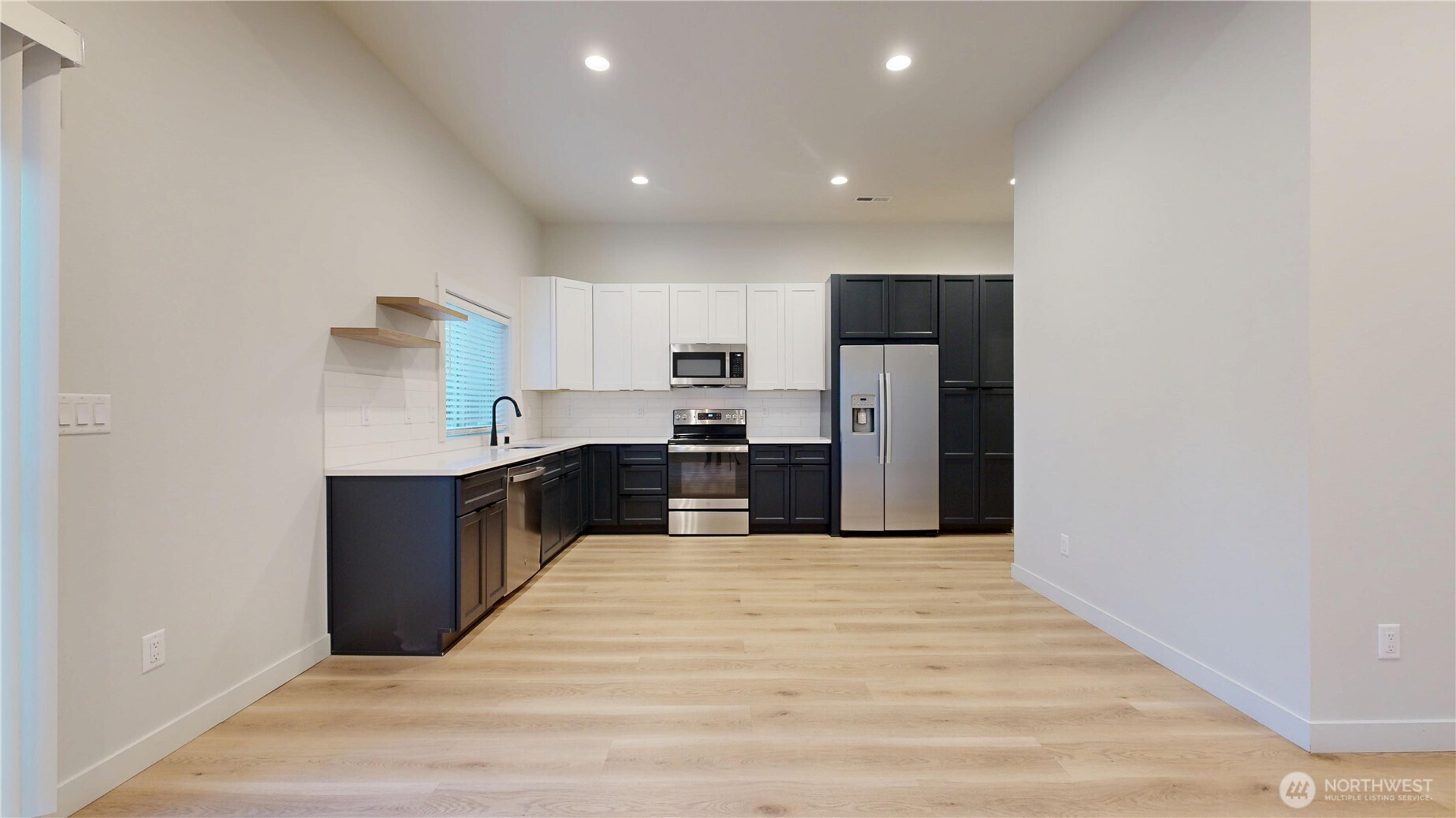 916 Hidden Lane Prosser, WA 99350 - Photo 6 of 24 a large kitchen with a refrigerator and a stove top oven