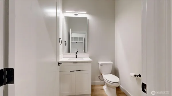 a view of a room with wooden floor and window