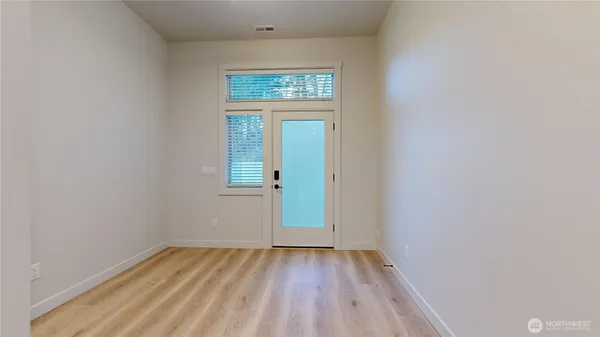 a view of entryway with wooden floor
