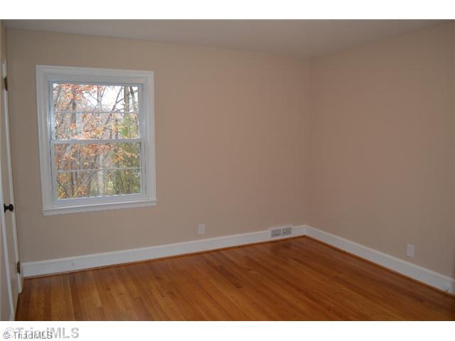 3389 Nottingham Road Winston-Salem, NC 27104 - Photo 14 of 24 2nd Bedroom. Main level 11 6 x 11 11 bedroom with refinished hardwoods