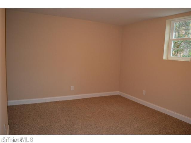 3389 Nottingham Road Winston-Salem, NC 27104 - Photo 21 of 24 3rd Bedroom. Lower level 12 x 13 bedroom perfect for teen or guests. Has large walk in closet