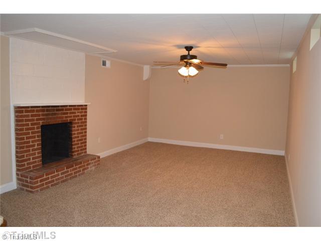 3389 Nottingham Road Winston-Salem, NC 27104 - Photo 22 of 24 Playroom. Large lower level playroom with wood burning fireplace