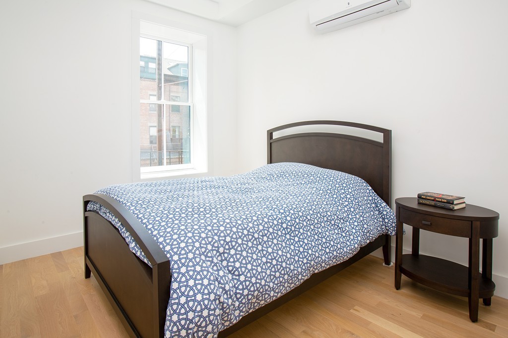 55 East Springfield Street, Unit 4 Boston, MA 02118 - Photo 6 of 7 a bedroom with a bed and window