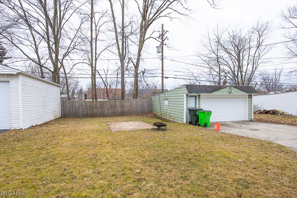4242 Wyncote Road South Euclid, OH 44121 - Photo 5 of 22 View of yard with an outdoor structure and a garage