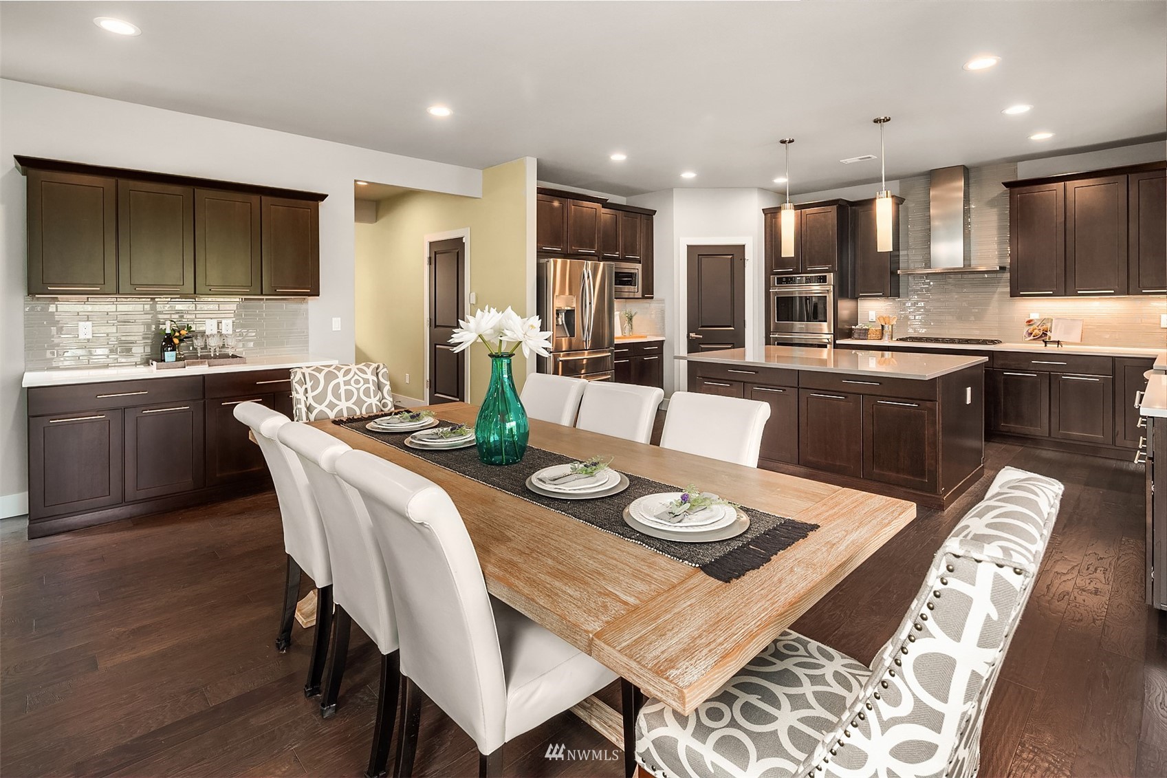 20611 37th Avenue Southeast Bothell, WA 98021 - Photo 16 of 40 a large kitchen with a table and chairs