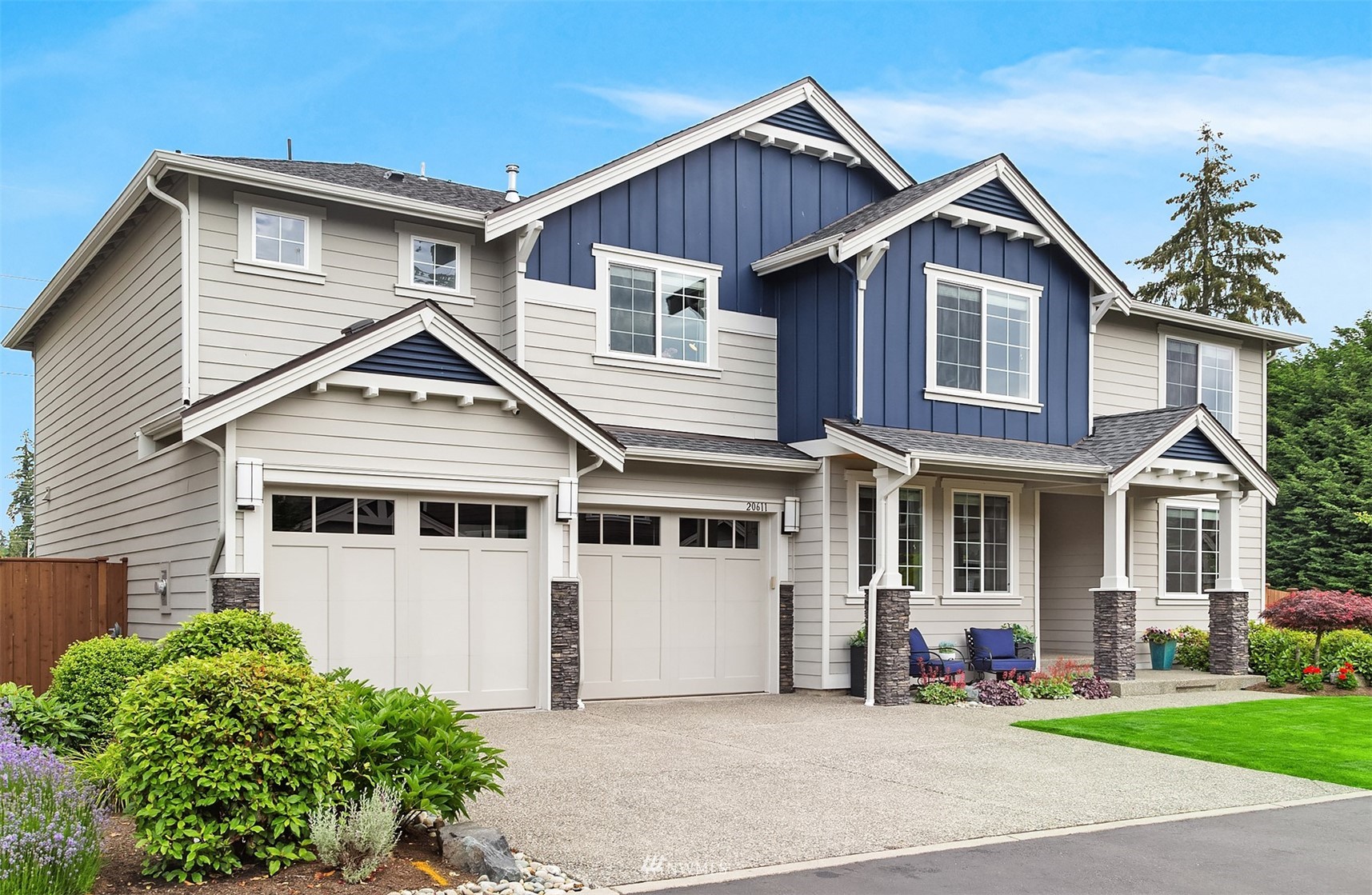 20611 37th Avenue Southeast Bothell, WA 98021 - Photo 2 of 40 a front view of a house with a yard