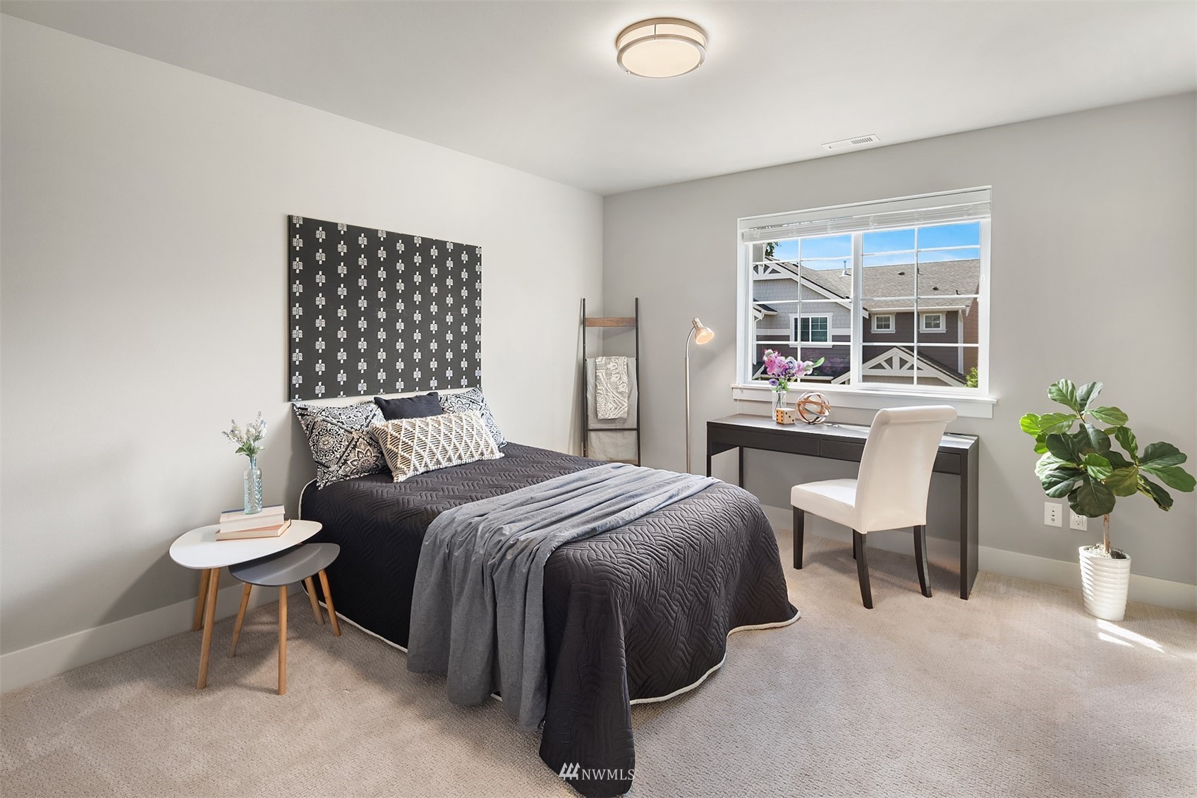 20611 37th Avenue Southeast Bothell, WA 98021 - Photo 22 of 40 a bedroom with a bed and a potted plant