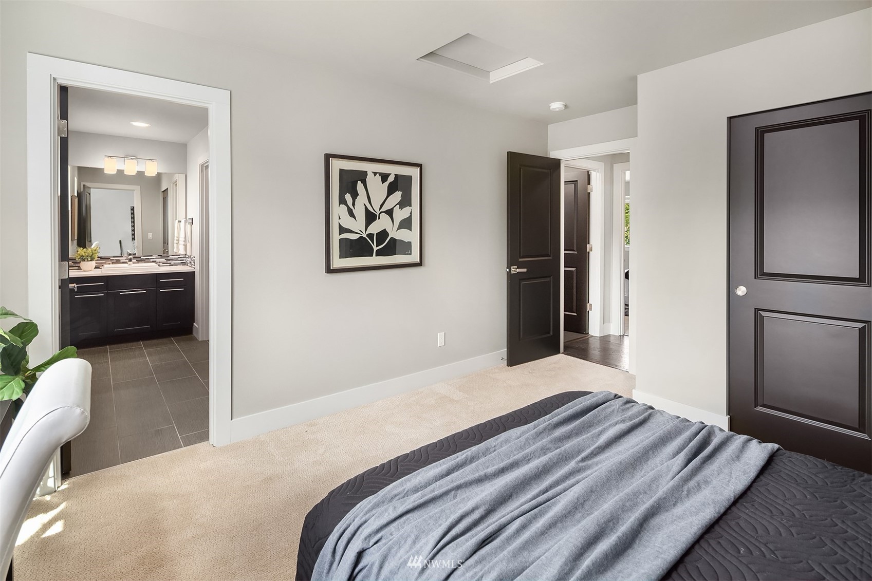 20611 37th Avenue Southeast Bothell, WA 98021 - Photo 23 of 40 a bedroom with a bed and a view of bathroom