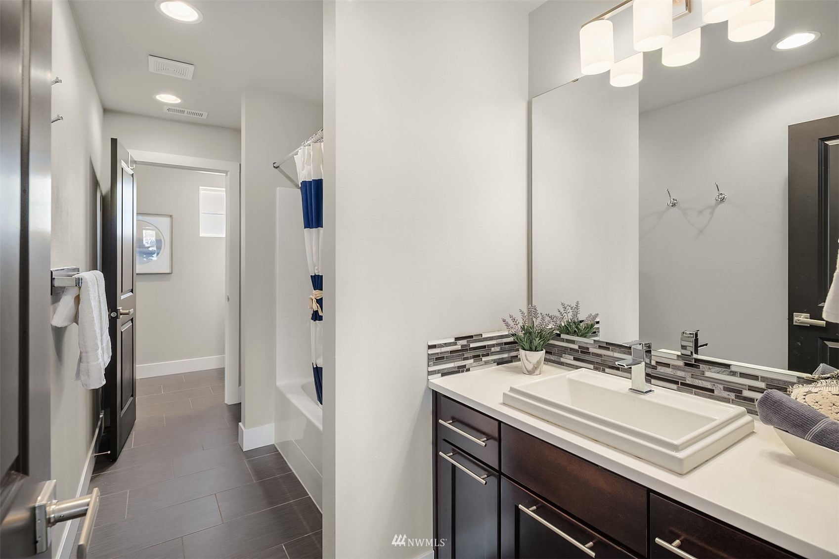 20611 37th Avenue Southeast Bothell, WA 98021 - Photo 25 of 40 a bathroom with a sink double vanity and a mirror