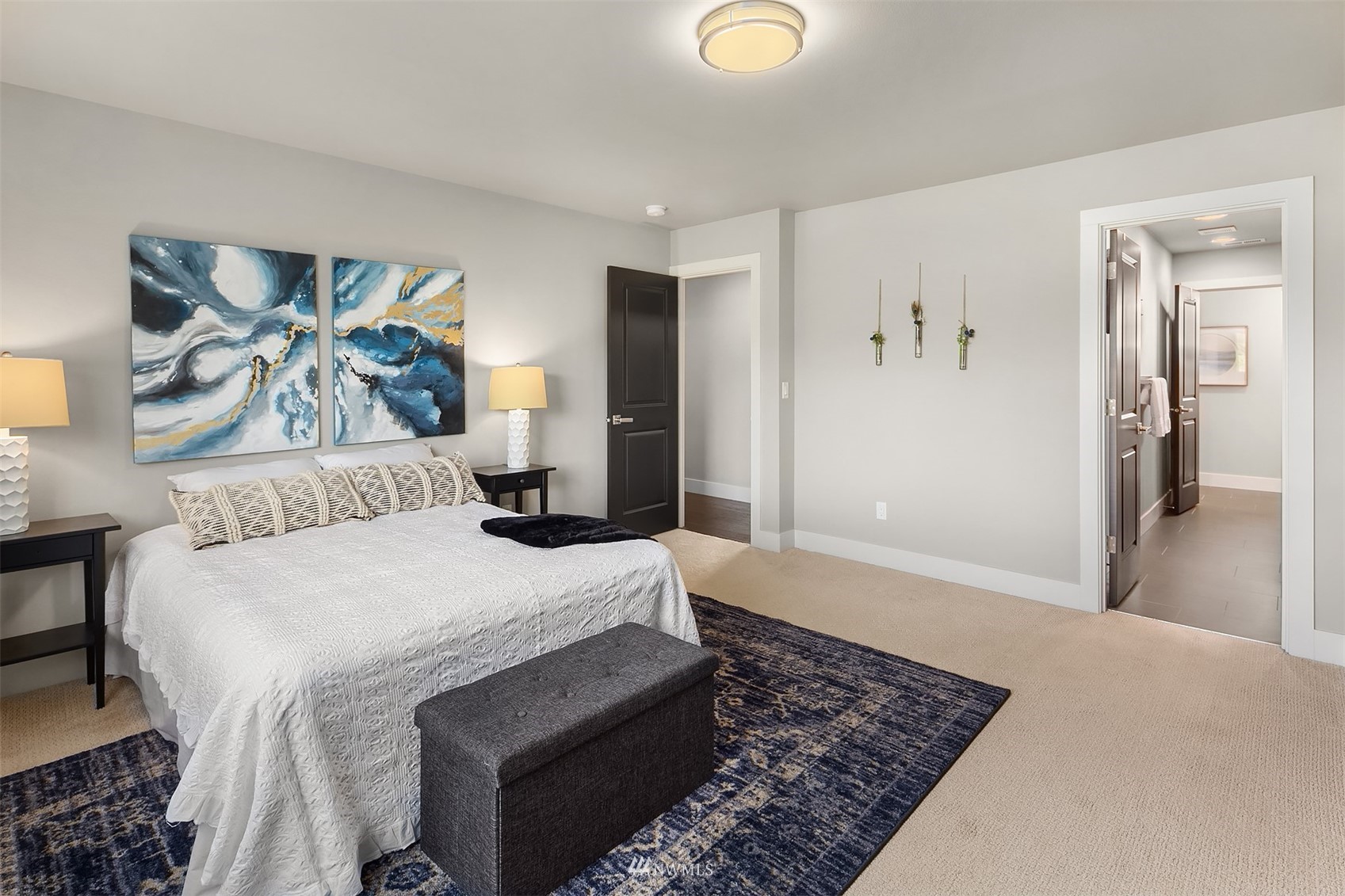 20611 37th Avenue Southeast Bothell, WA 98021 - Photo 27 of 40 a bedroom with a large bed and a couch