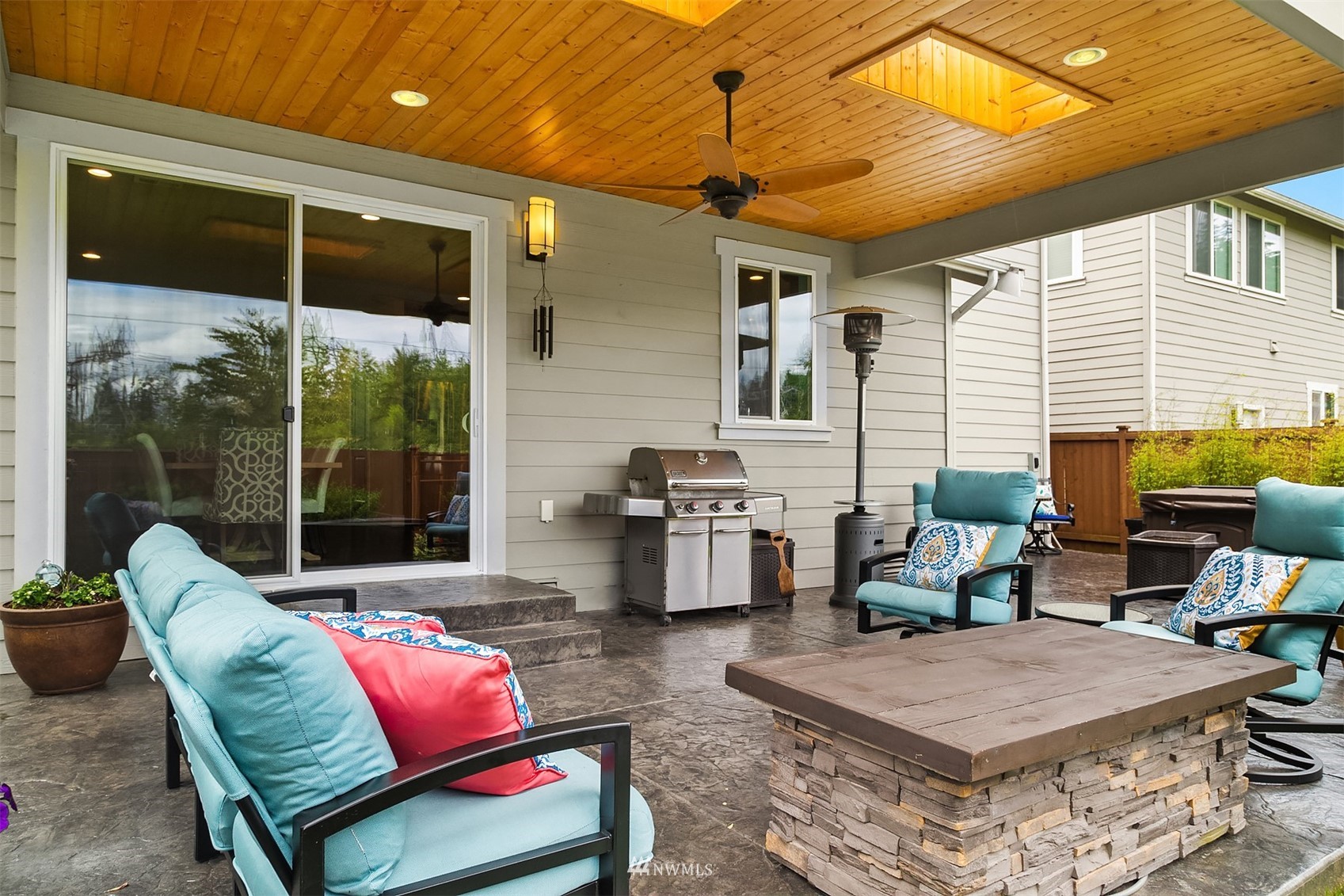20611 37th Avenue Southeast Bothell, WA 98021 - Photo 37 of 40 a outdoor space with patio the couches and a dining table with the view of kitchen