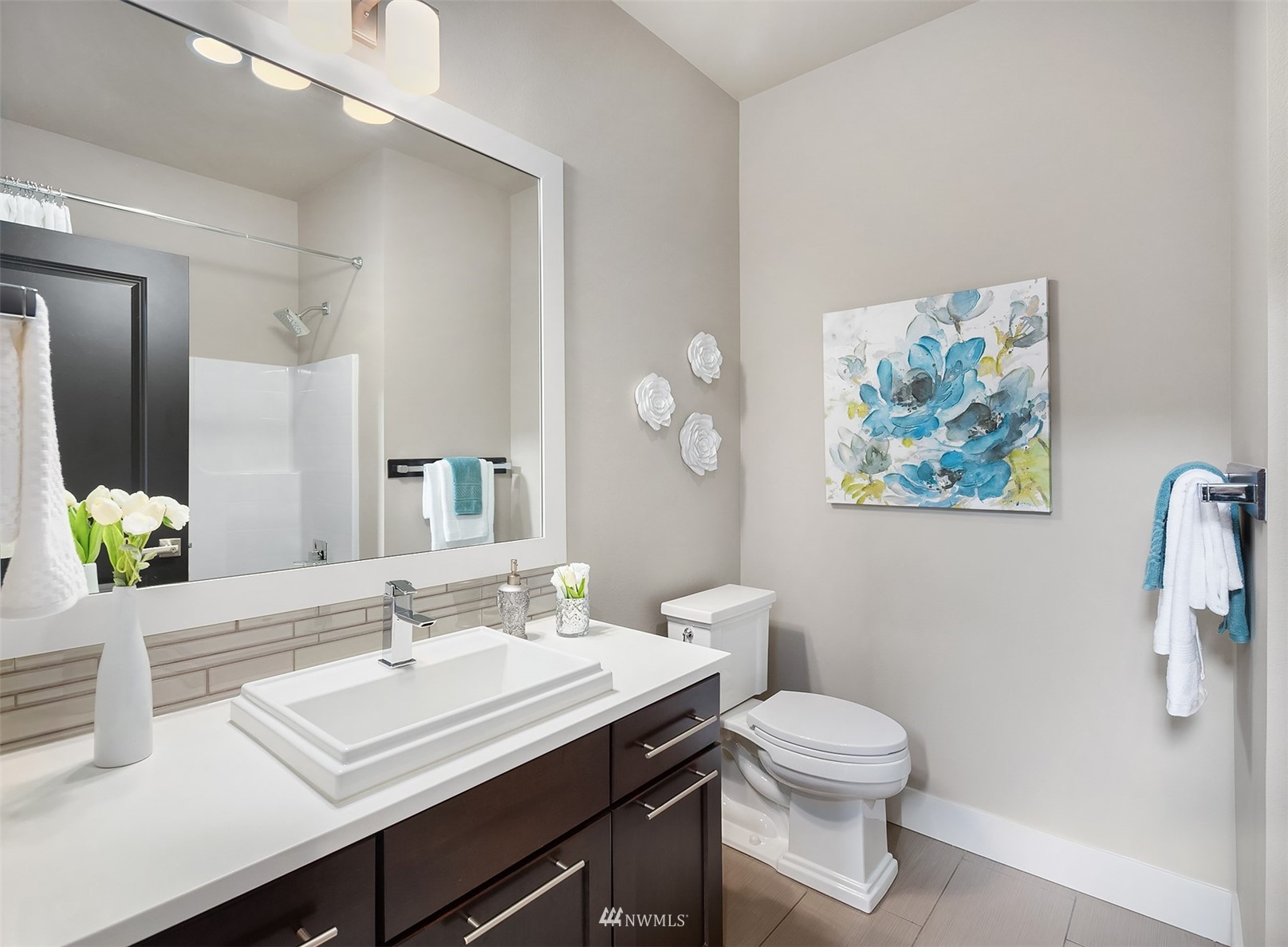 20611 37th Avenue Southeast Bothell, WA 98021 - Photo 7 of 40 a bathroom with a toilet a sink and mirror