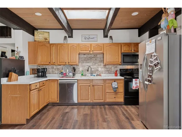 a bathroom with a sink a mirror and window