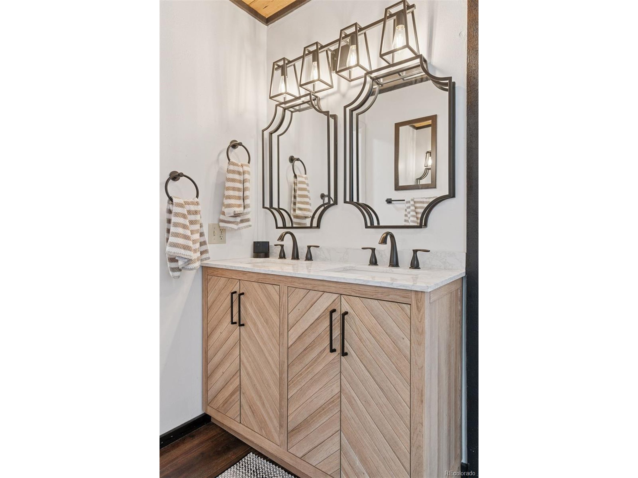 16880 Old Pueblo Road Fountain, CO 80817 - Photo 14 of 49 a bathroom with mirror and sink