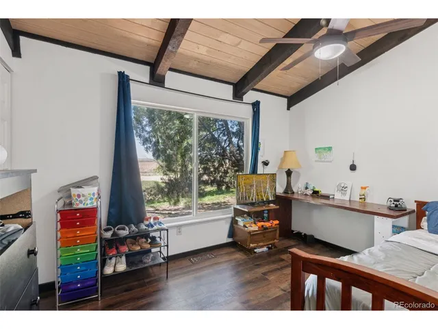 a kitchen with stainless steel appliances granite countertop a sink a stove a refrigerator cabinets a sink and a stove