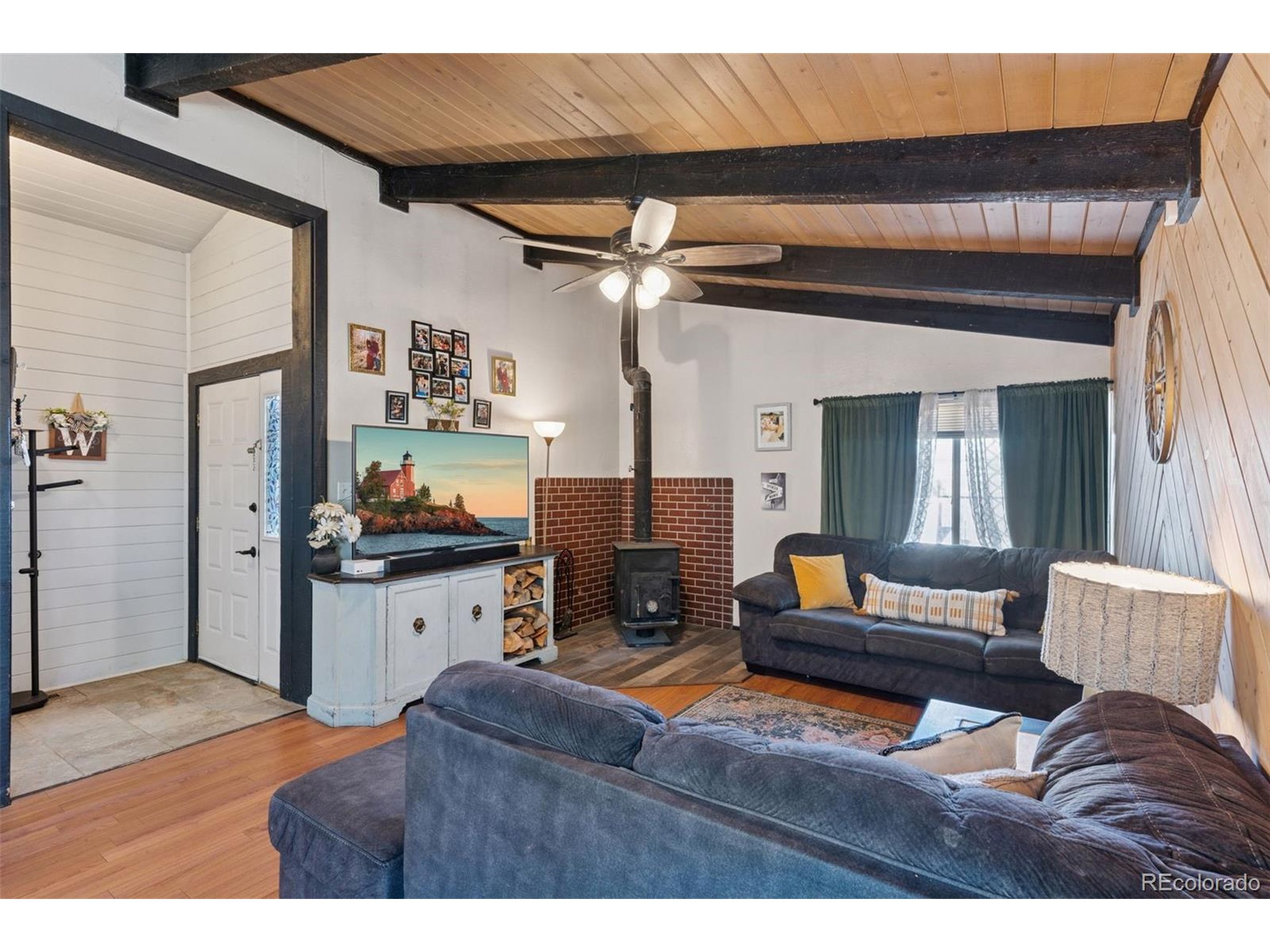 16880 Old Pueblo Road Fountain, CO 80817 - Photo 25 of 49 a living room with furniture and a chandelier