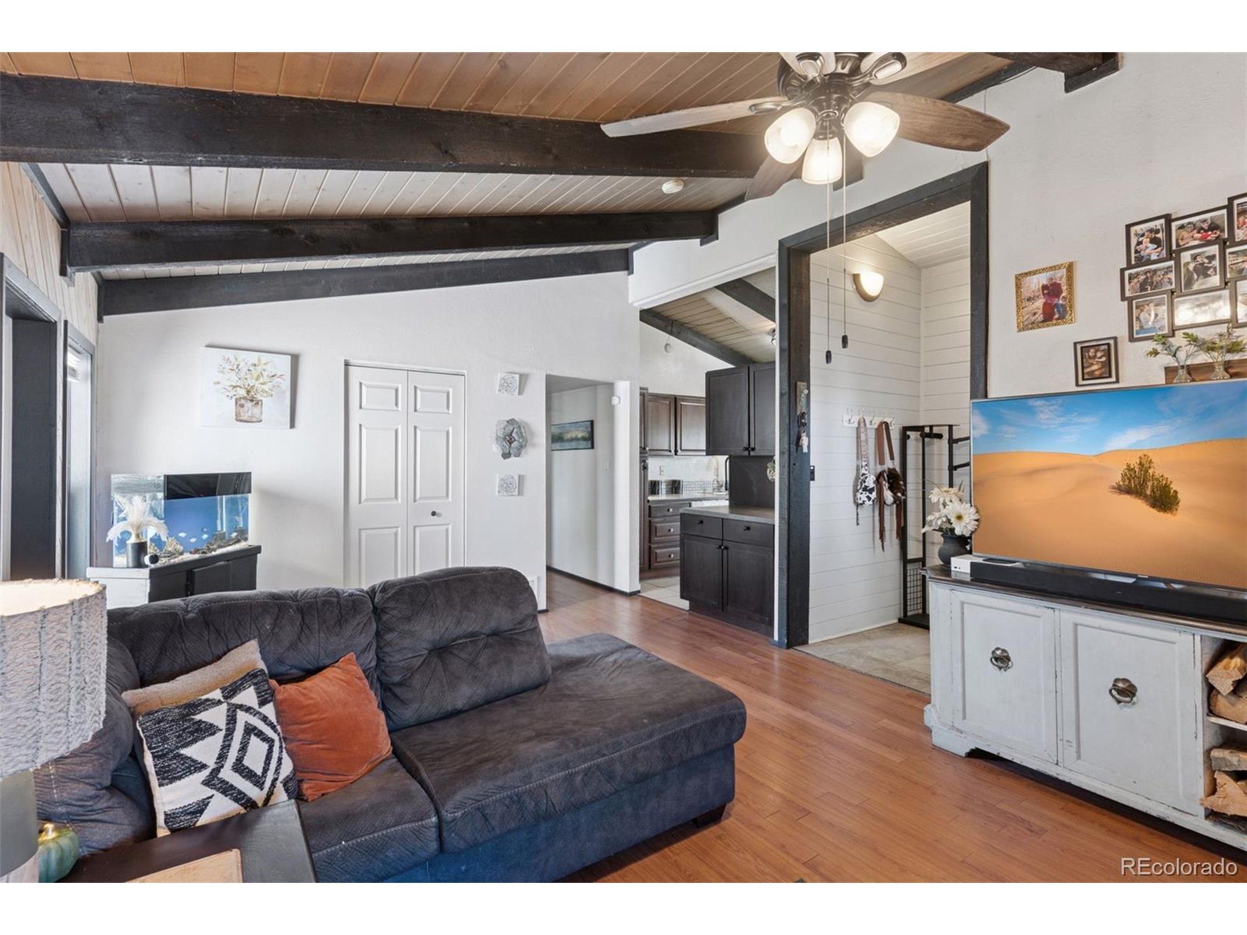 16880 Old Pueblo Road Fountain, CO 80817 - Photo 26 of 49 a living room with furniture and a flat screen tv