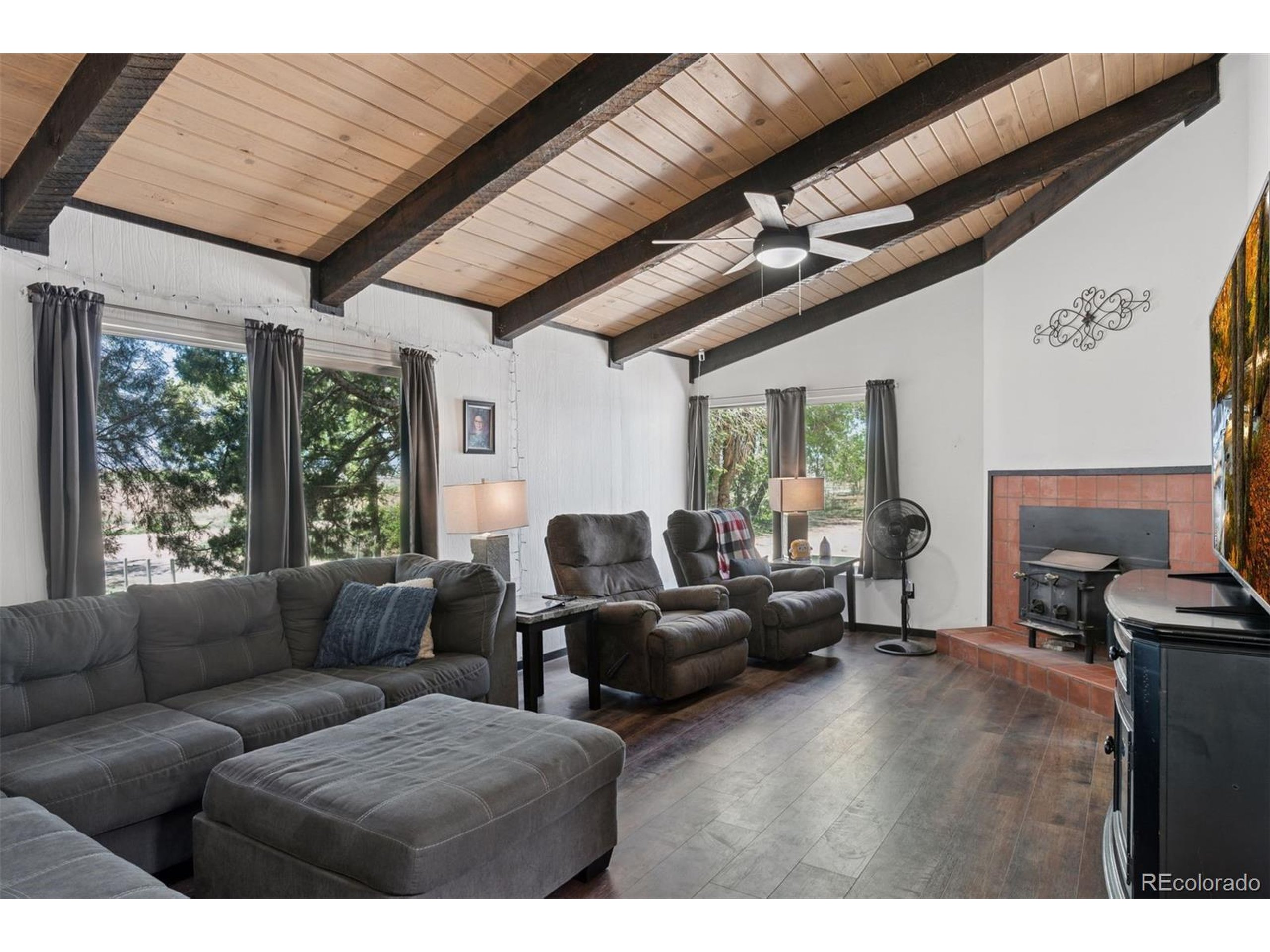 16880 Old Pueblo Road Fountain, CO 80817 - Photo 10 of 49 a living room with furniture ceiling fan and a window