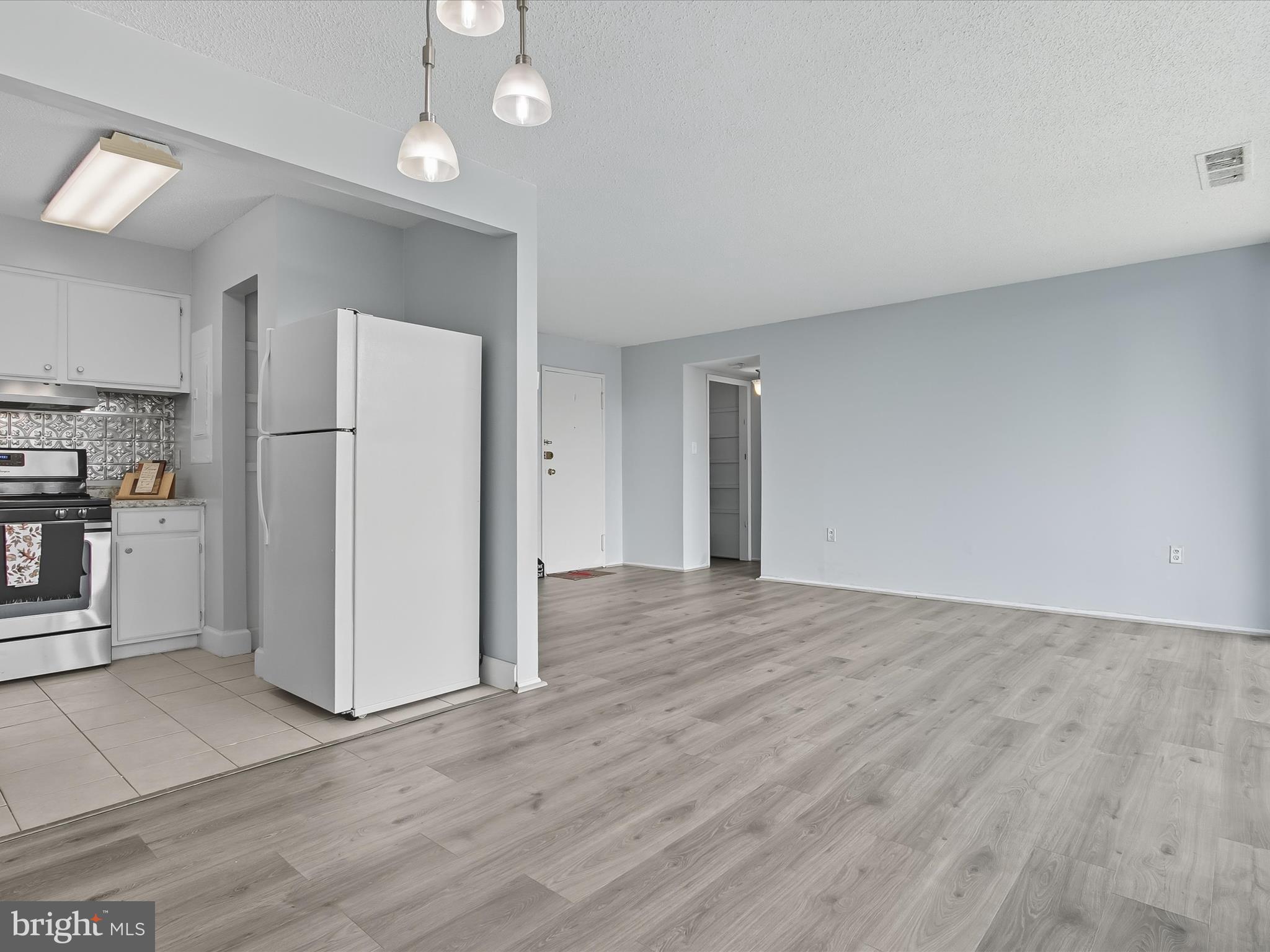 1828 Metzerott Road, Unit 408 Adelphi, MD 20783 - Photo 9 of 26 Living and Dining Areas