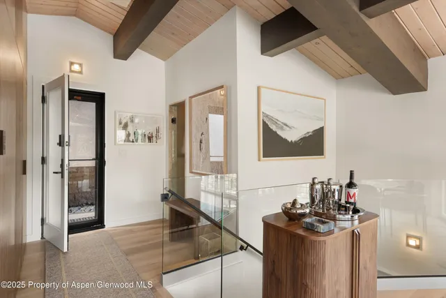 a bathroom with a sink mirror and vanity