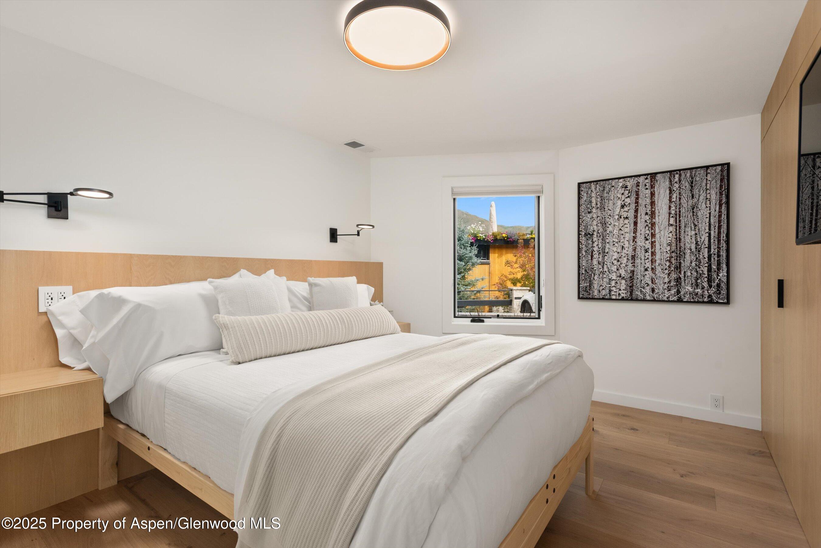 809 South Aspen Street, Unit 2 Aspen, CO 81611 - Photo 17 of 25 a bedroom with a bed and a couch