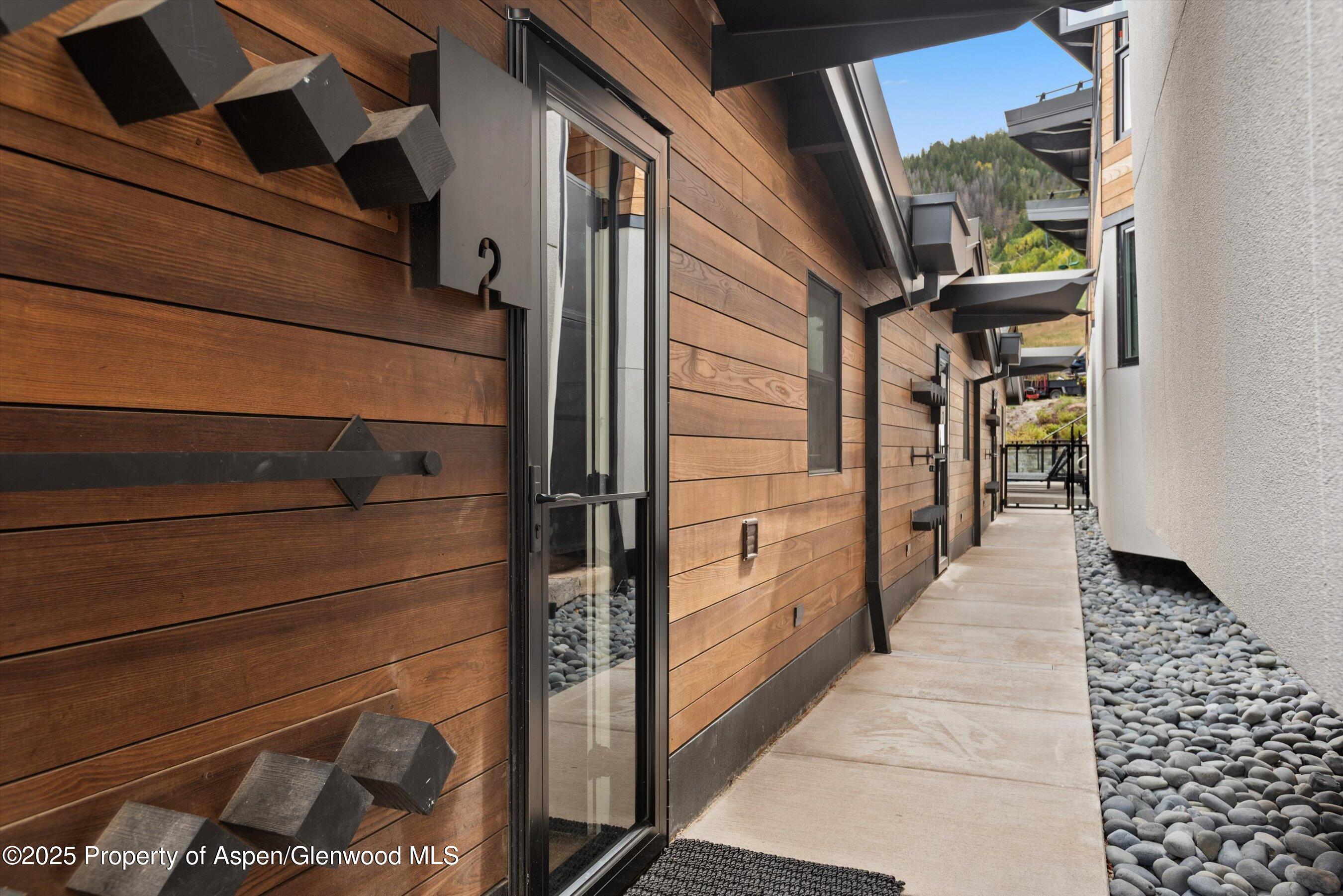 809 South Aspen Street, Unit 2 Aspen, CO 81611 - Photo 22 of 25 a hallway with a view of living room