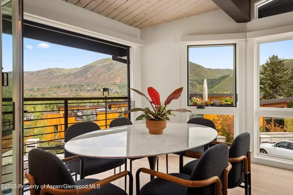 a view of a dining room with furniture window and outside view