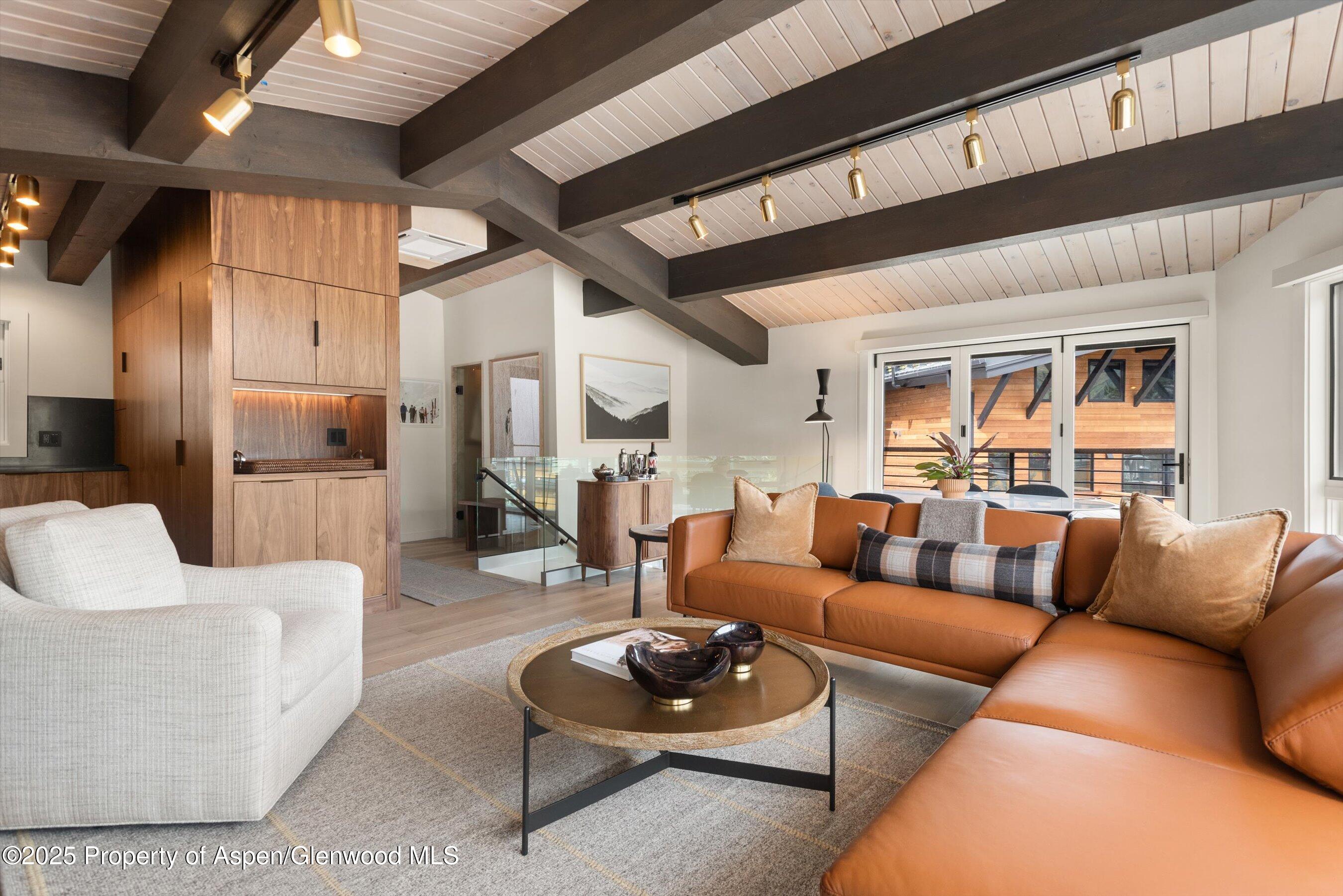 809 South Aspen Street, Unit 2 Aspen, CO 81611 - Photo 9 of 25 a living room with furniture and a wooden floor