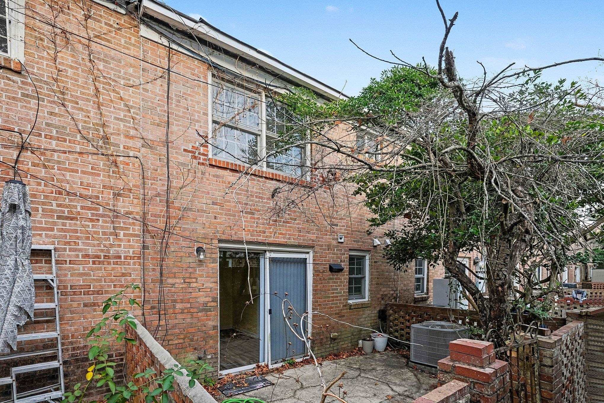 513 65th Avenue North, Unit I Myrtle Beach, SC 29572 - Photo 19 of 21 Rear view of property featuring a patio area and brick siding
