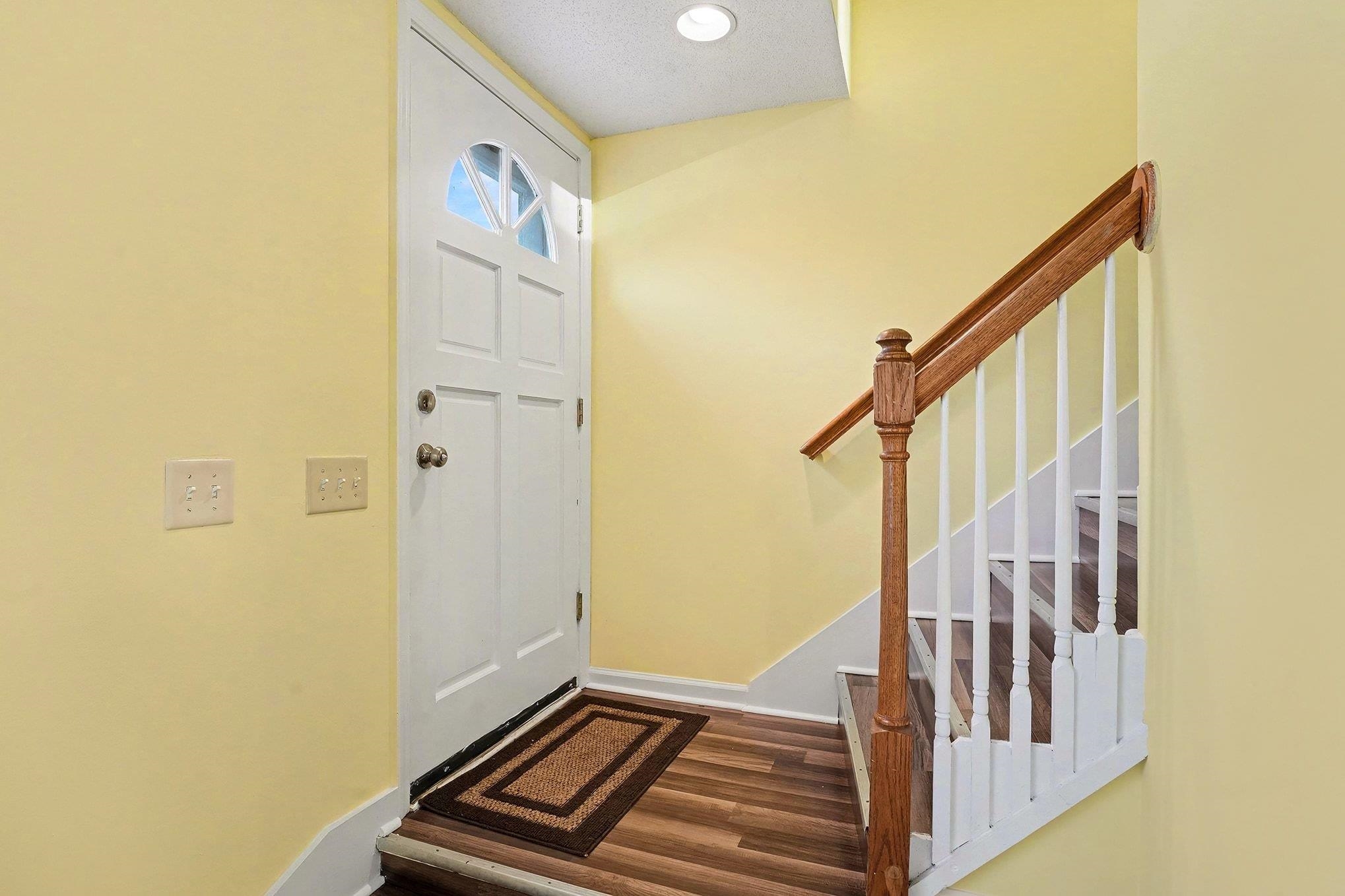 513 65th Avenue North, Unit I Myrtle Beach, SC 29572 - Photo 4 of 21 Entryway with dark LVP floors, stairway, and recessed lighting