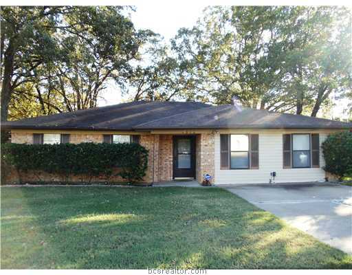 4502 Old Hearne Road Bryan, TX 77803 - Photo 1 of 1 a front view of a house with a yard and potted plants