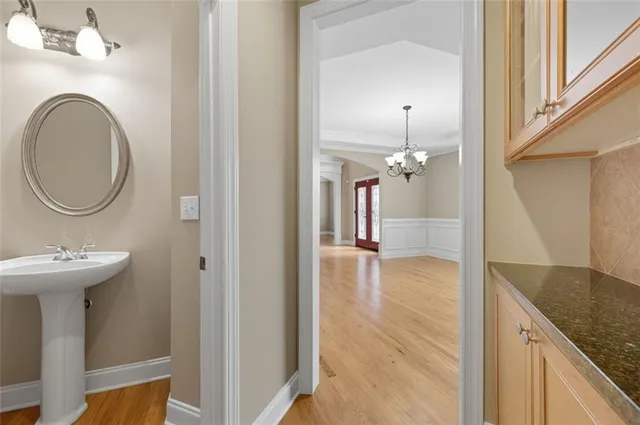 a view of a bathroom with a sink and a mirror