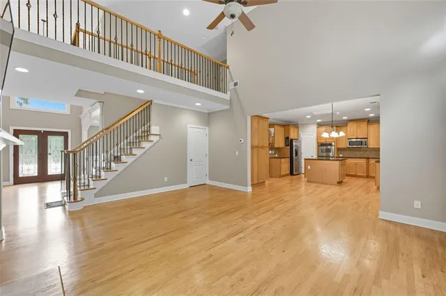 a view of an entryway with wooden floor