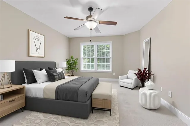 a bedroom with bed and a large window