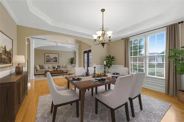 a view of a dining room with furniture window and wooden floor