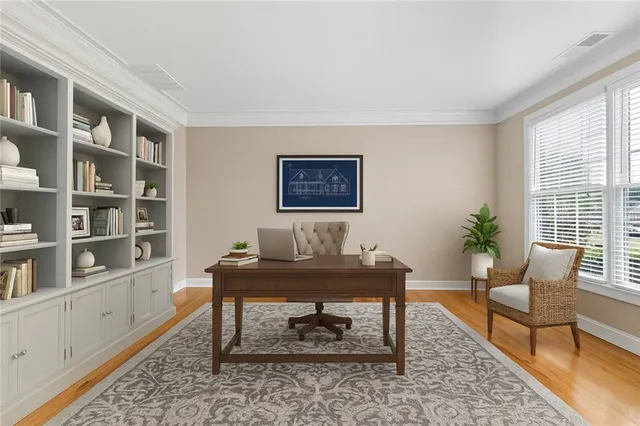 a workspace with furniture and a book shelf