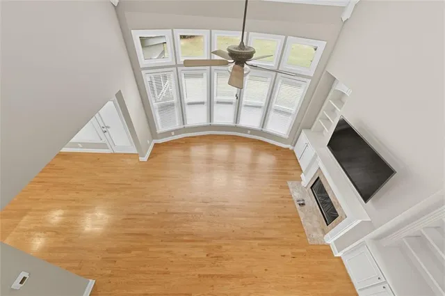 a view of an empty room with a fireplace