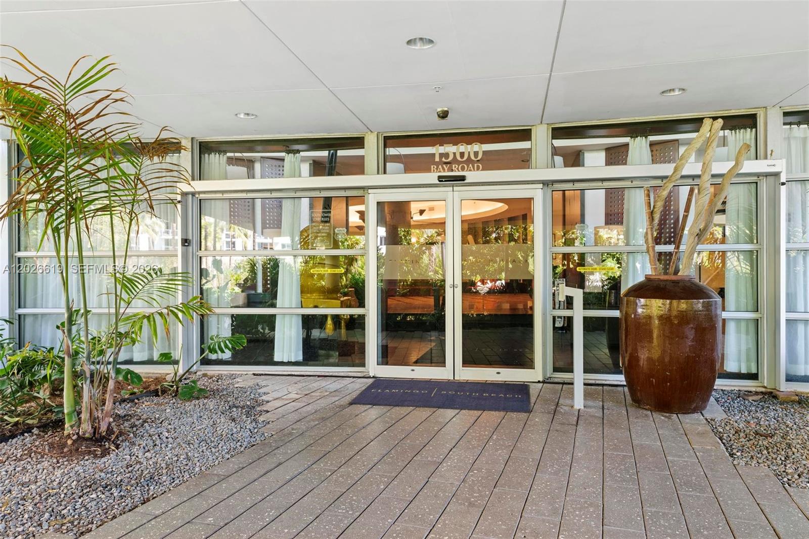 1500 Bay Road, Unit 1268S Miami Beach, FL 33139 - Photo 19 of 31 a view of a balcony with wooden floor and outdoor space