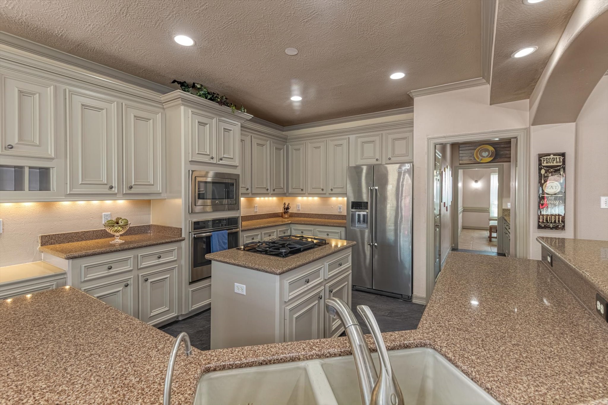 18422 Bivens Bend Spring, TX 77379 - Photo 15 of 50 a kitchen with stainless steel appliances granite countertop a refrigerator and a stove top oven