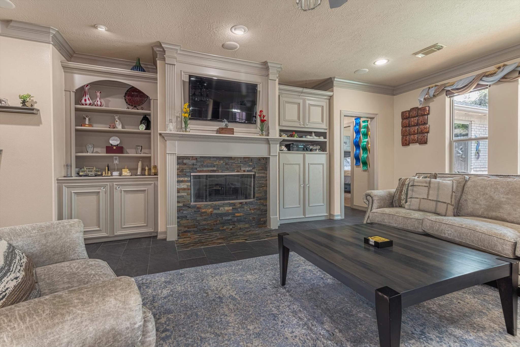 18422 Bivens Bend Spring, TX 77379 - Photo 20 of 50 a living room with furniture and a fireplace