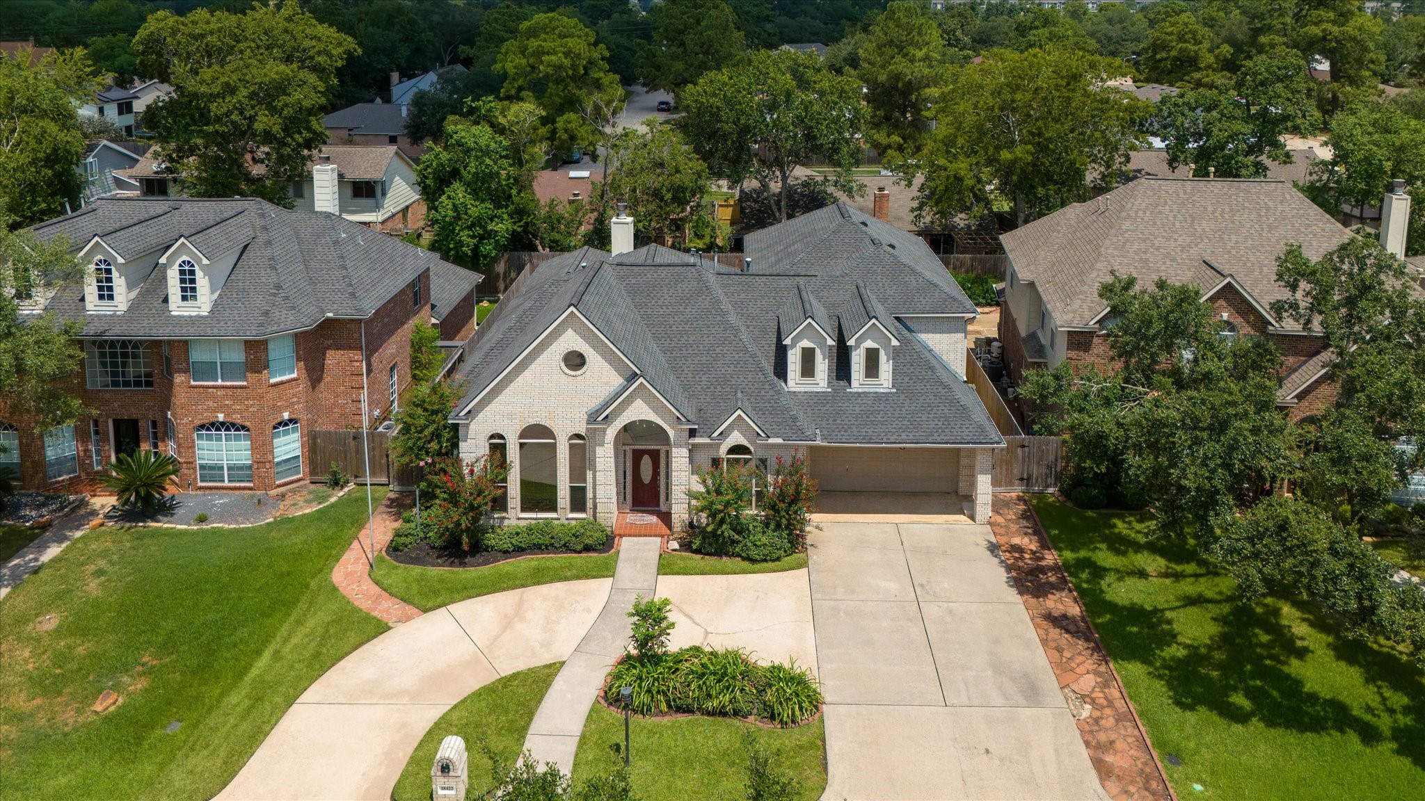 18422 Bivens Bend Spring, TX 77379 - Photo 2 of 50 a aerial view of a house next to a big yard and large trees