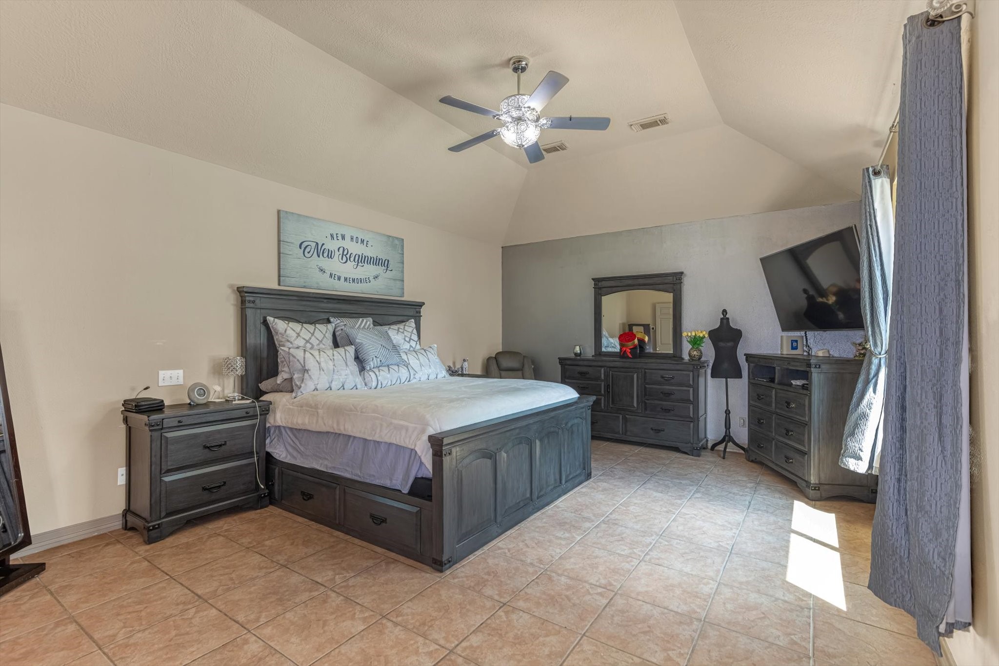 18422 Bivens Bend Spring, TX 77379 - Photo 21 of 50 a spacious bedroom with a bed and a flat screen tv