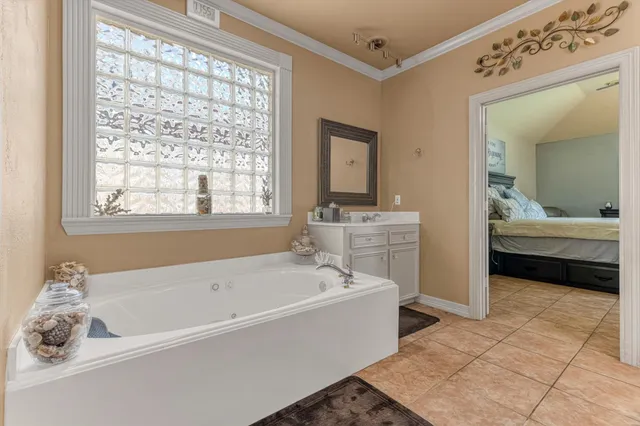 a spacious bathroom with a shower sink and mirror
