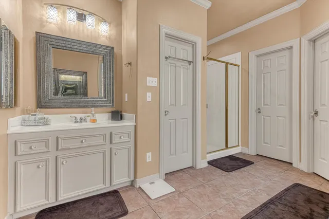 a bathroom with a shower and a sink