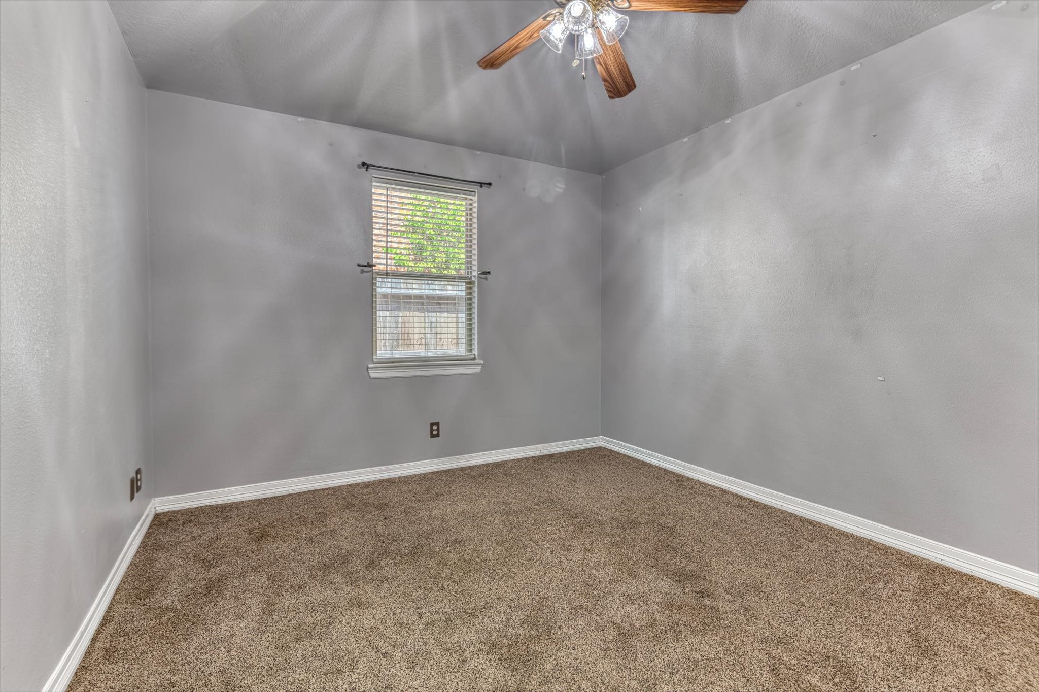 18422 Bivens Bend Spring, TX 77379 - Photo 28 of 50 an empty room with a chandelier fan