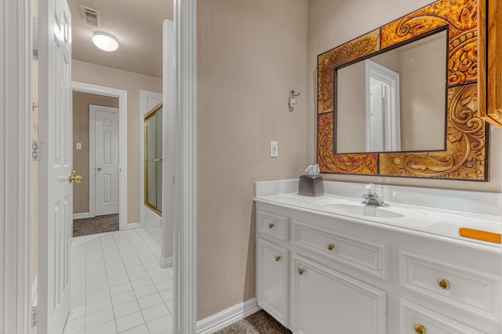 18422 Bivens Bend Spring, TX 77379 - Photo 37 of 50 a bathroom with a sink and a mirror