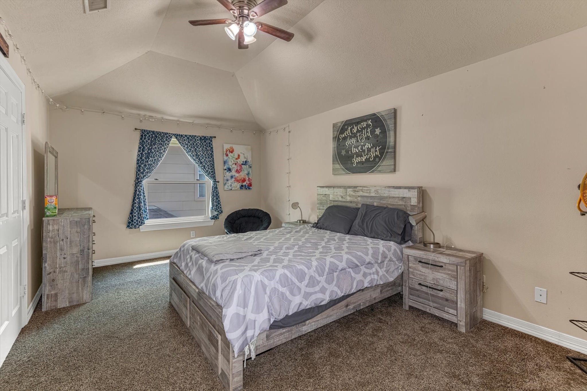 18422 Bivens Bend Spring, TX 77379 - Photo 42 of 50 a bedroom with a bed and a chandelier