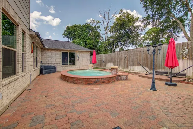 a swimming pool with outdoor seating