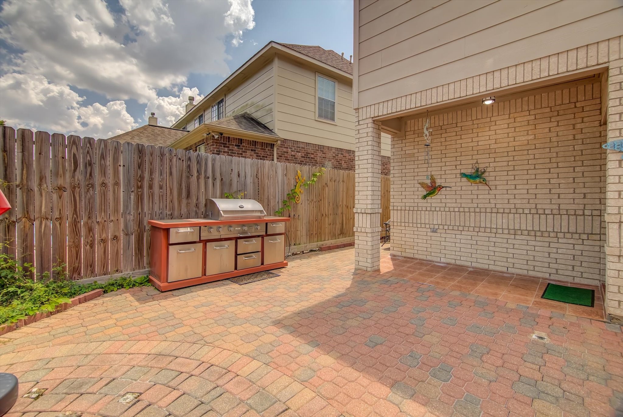 18422 Bivens Bend Spring, TX 77379 - Photo 49 of 50 a backyard of a house with barbeque oven table and chairs